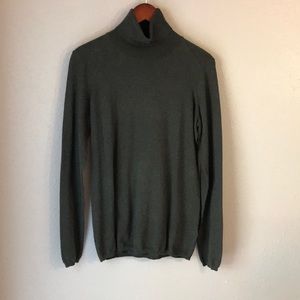 Olive green turtleneck sweater.